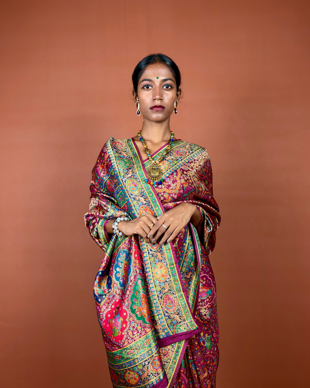 Maroon Banarasi Silk Saree with Gold Zari Jaal and Emerald Border