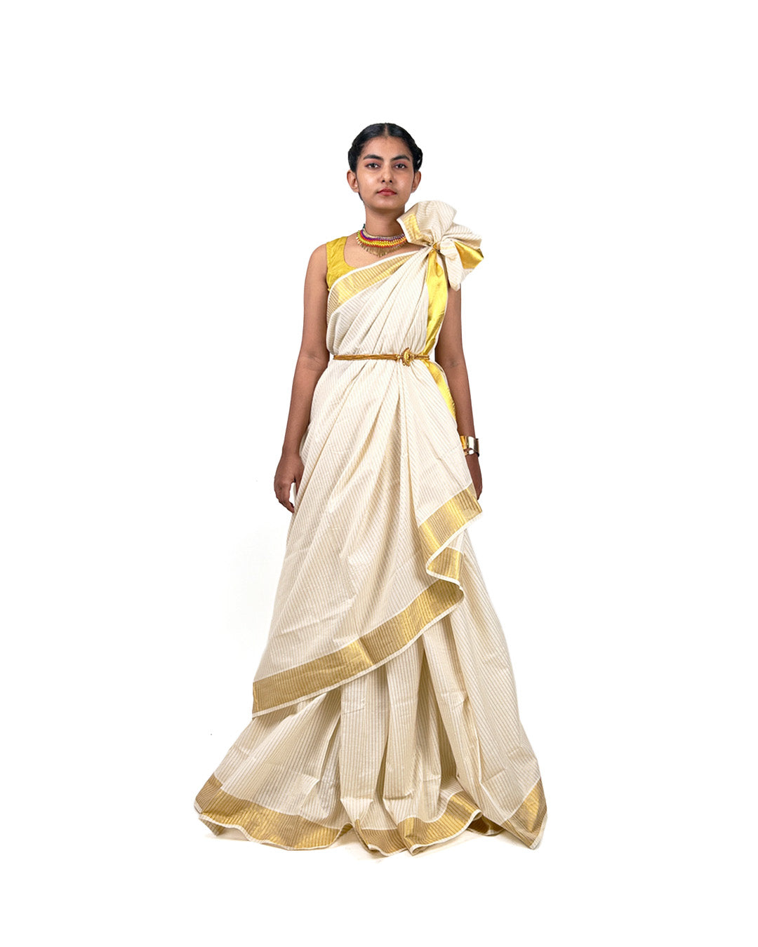 Woman wearing a white kasavu kerala saree with gold border and yellow blouse on a white background